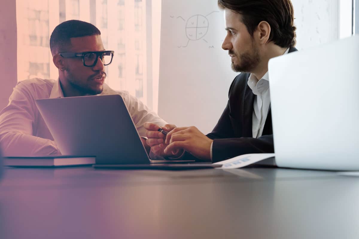 Boss and employee addressing Conflict Resolution Strategies | Axion Clients