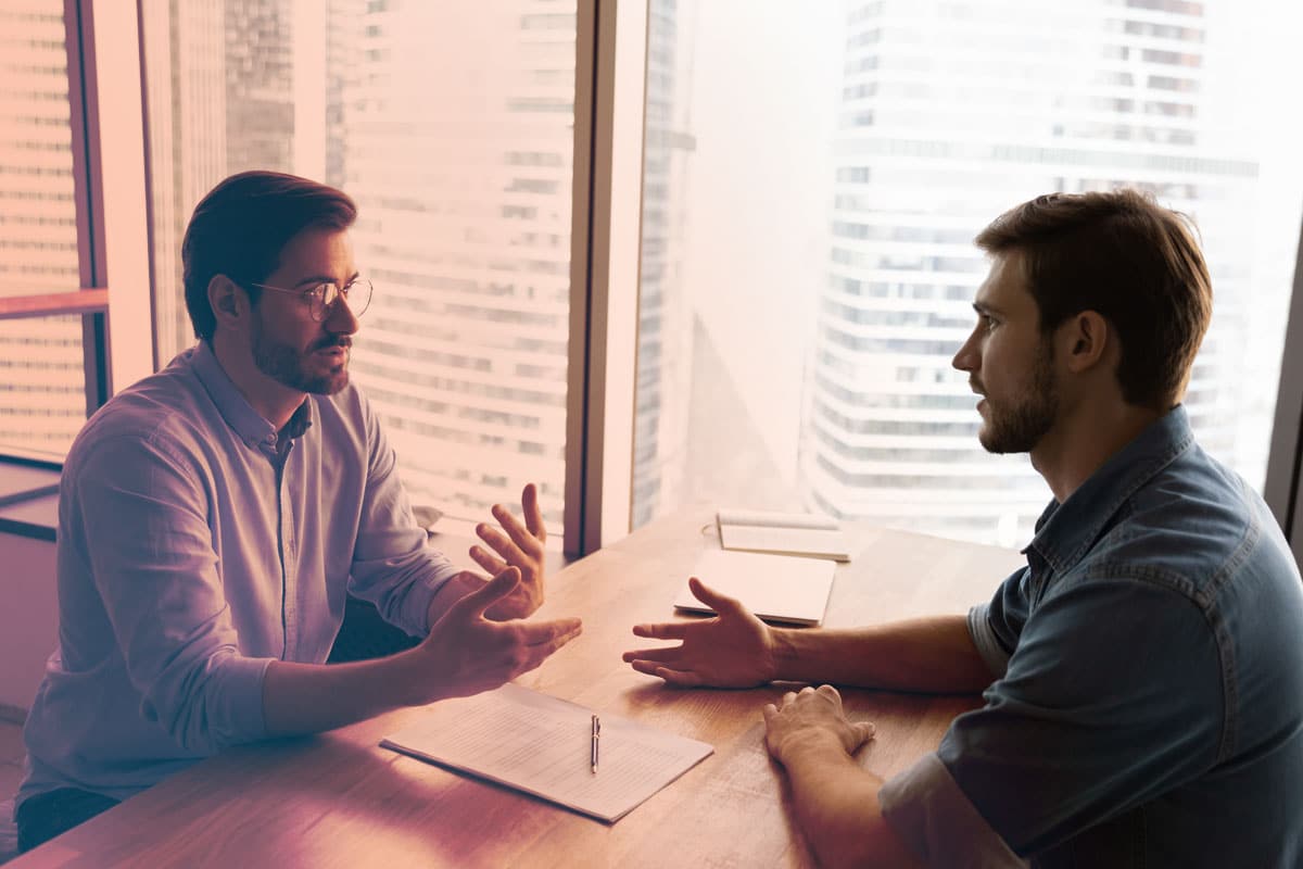 Executive addressing Conflict Resolution Strategies | Axion Clients